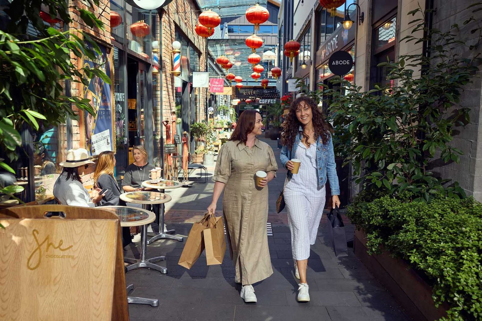 551320-two-friends-explore-the-shops-at-the-riverside-lanes-web-1920px-jpg Riverside Laneway